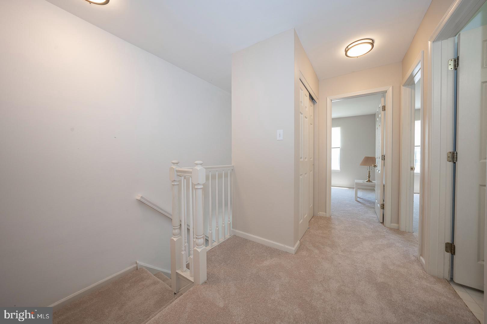 240 Springvalley Way Aston, PA 19014 - Photo 24 of 29 a view of a hallway with wooden shelves