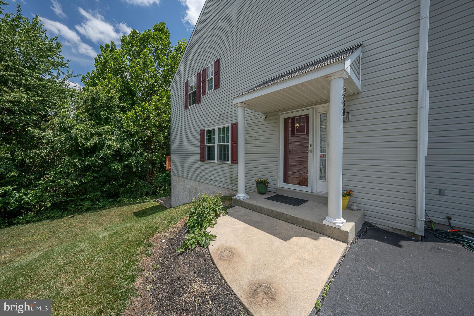 240 Springvalley Way Aston, PA 19014 - Photo 3 of 29 a front view of a house with garden