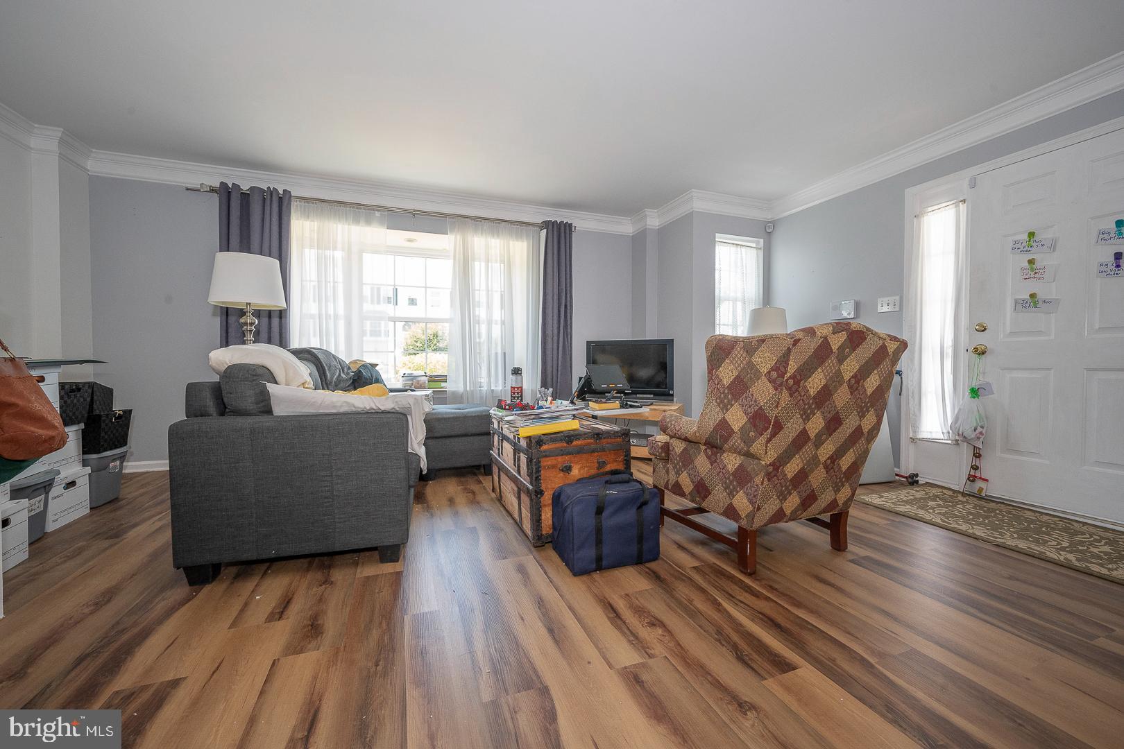 240 Springvalley Way Aston, PA 19014 - Photo 5 of 29 a living room with furniture and a wooden floor