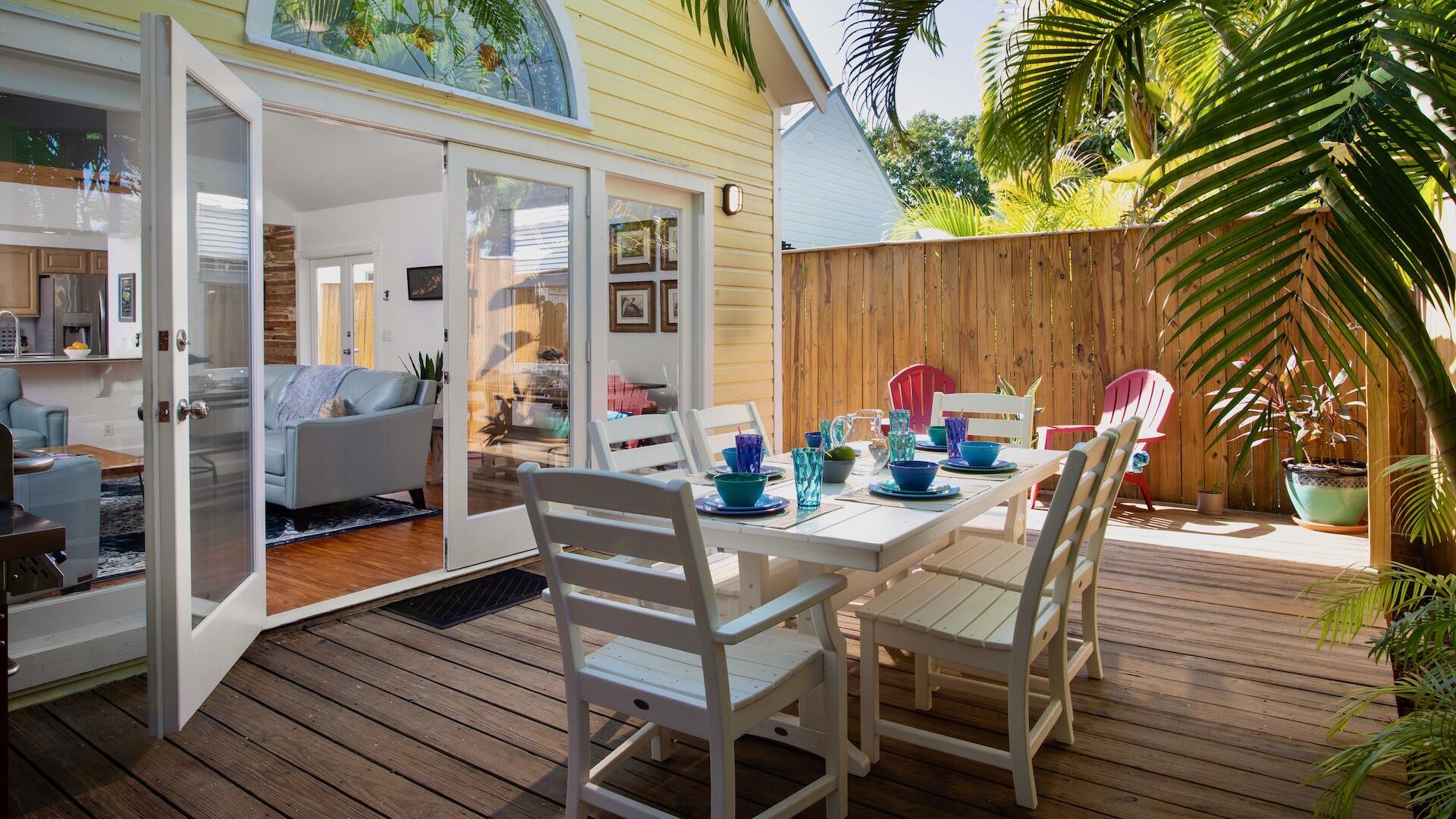 4 Aronovitz Lane Key West, FL 33040 - Photo 16 of 36 a view of a chairs and tables in patio