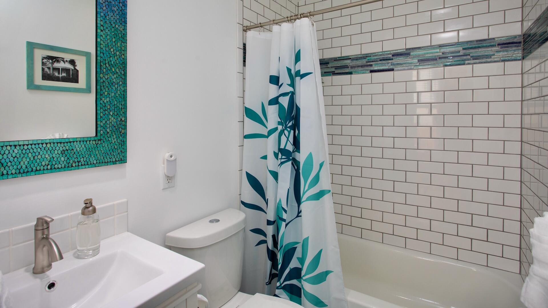 4 Aronovitz Lane Key West, FL 33040 - Photo 20 of 36 a bathroom with a sink a bathtub and a shower