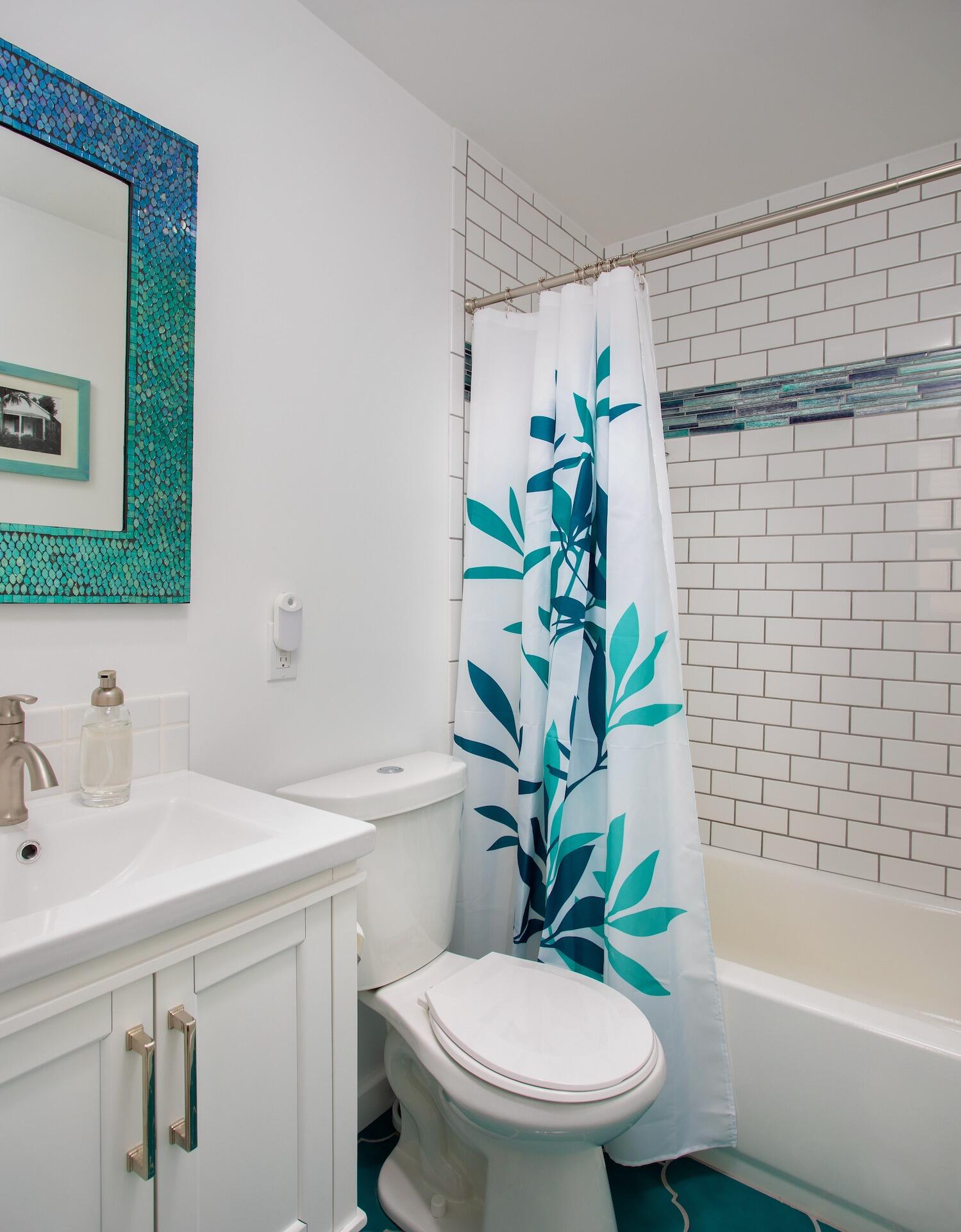 4 Aronovitz Lane Key West, FL 33040 - Photo 21 of 36 a bathroom with a sink a toilet a bathtub and shower