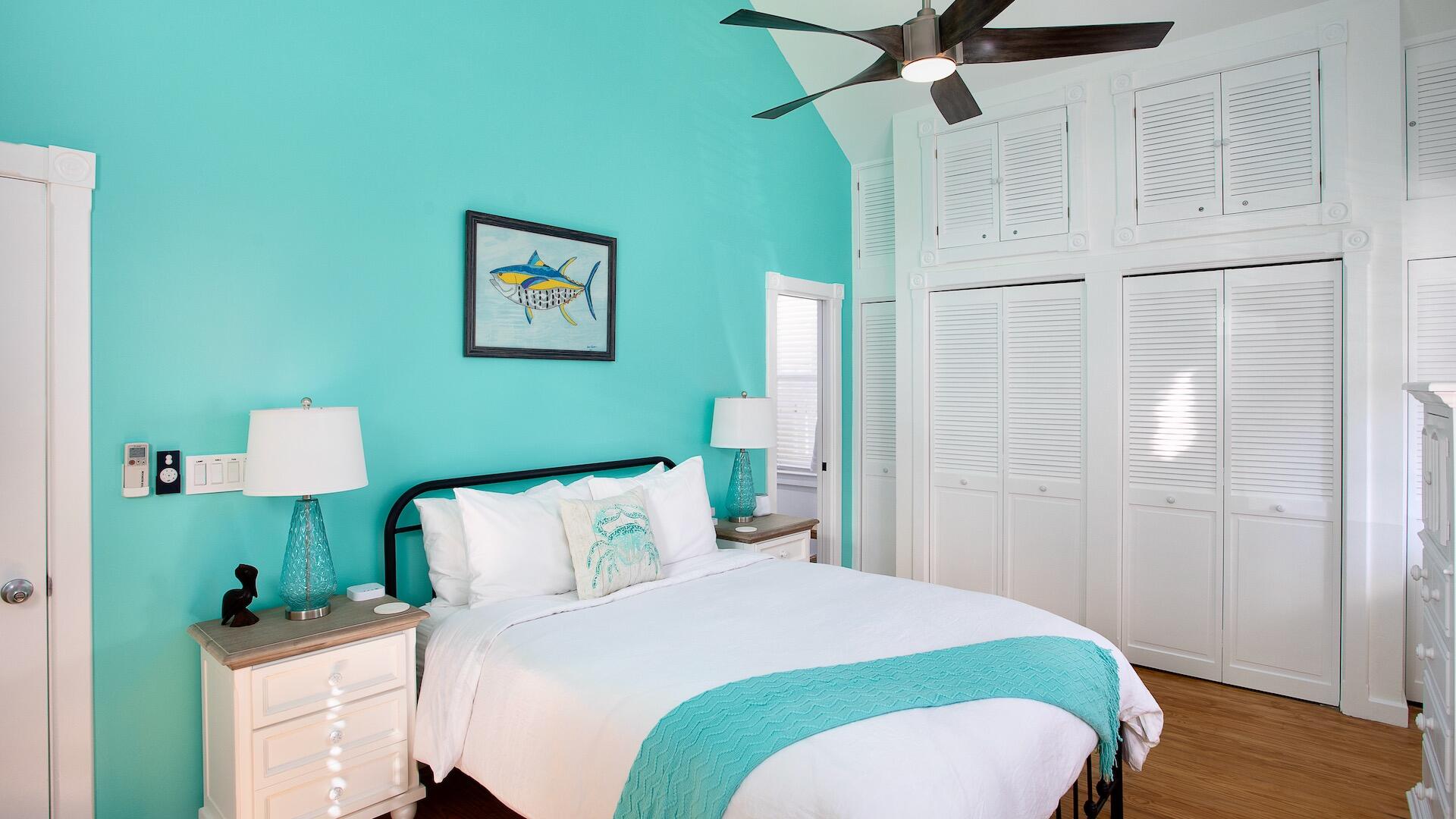 4 Aronovitz Lane Key West, FL 33040 - Photo 24 of 36 a bedroom with a bed and a chandelier