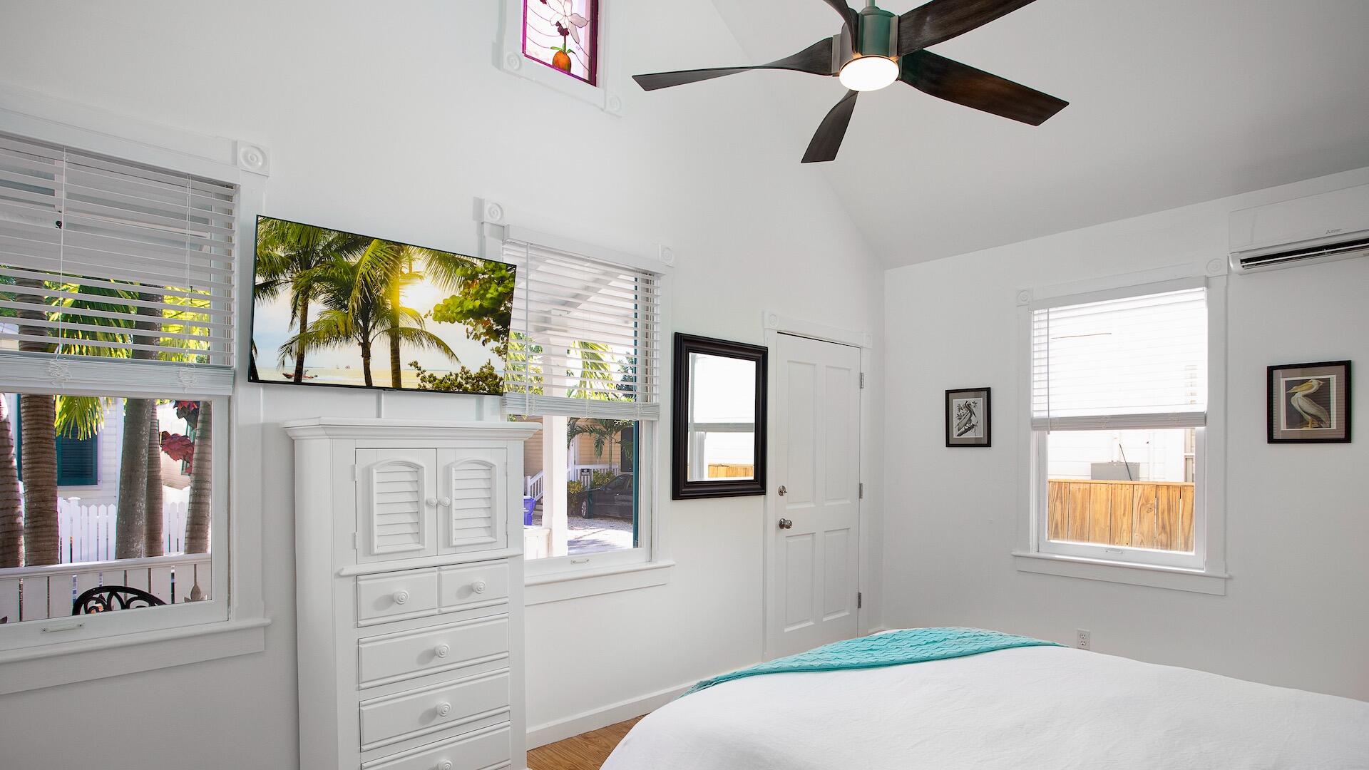 4 Aronovitz Lane Key West, FL 33040 - Photo 25 of 36 a bedroom with a bed and a flat screen tv