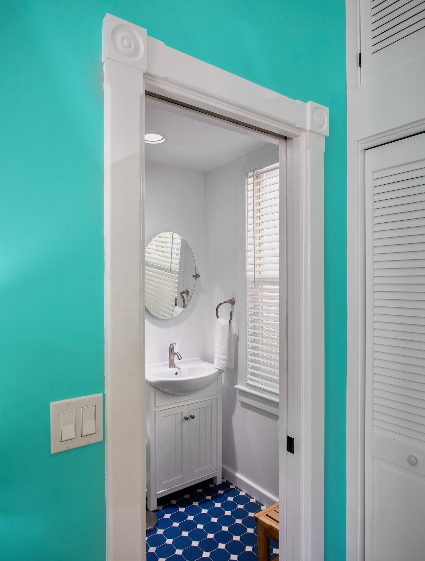 4 Aronovitz Lane Key West, FL 33040 - Photo 26 of 36 a bathroom with a sink a mirror and window