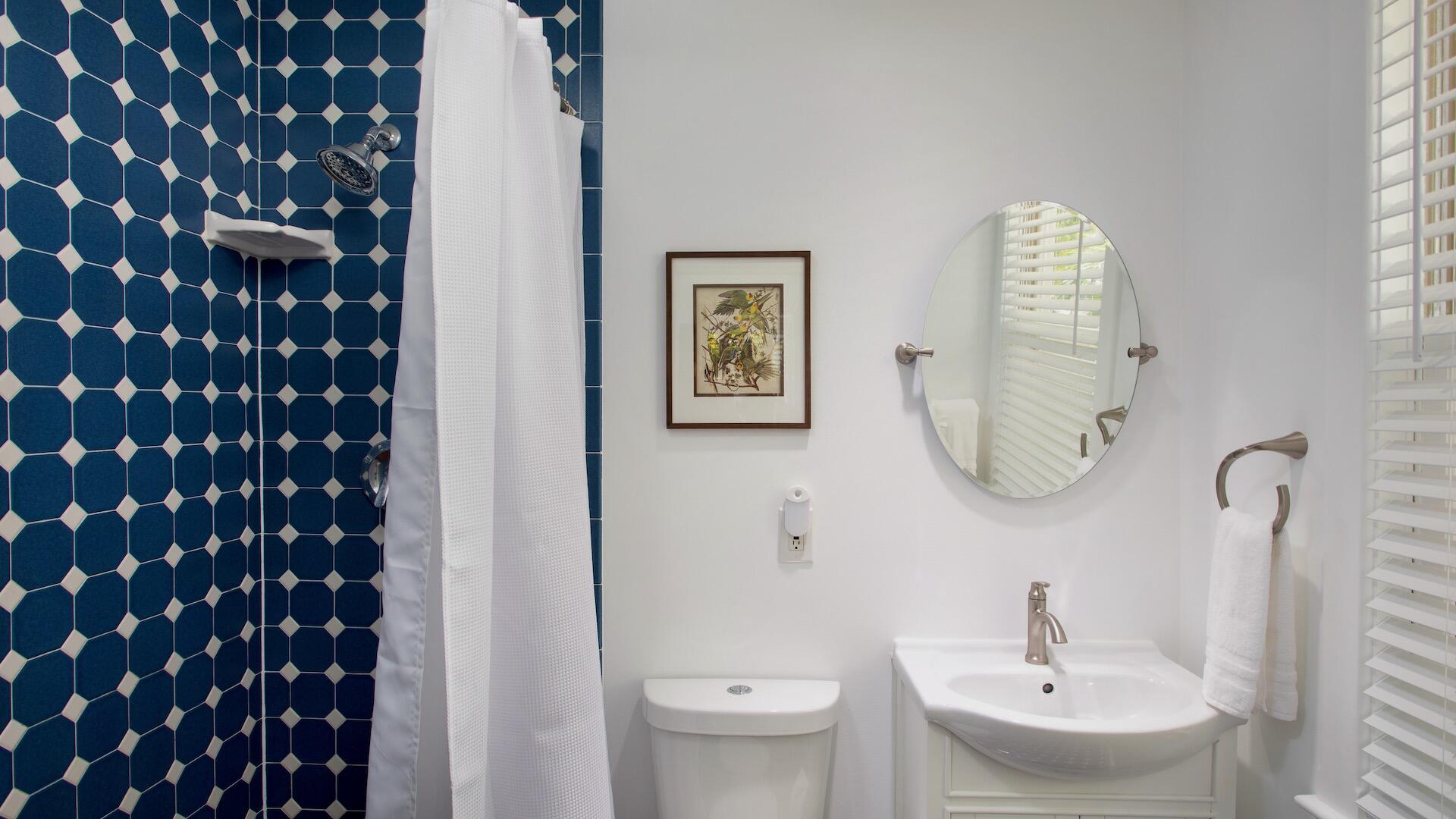 4 Aronovitz Lane Key West, FL 33040 - Photo 27 of 36 a bathroom with a sink a toilet and a mirror