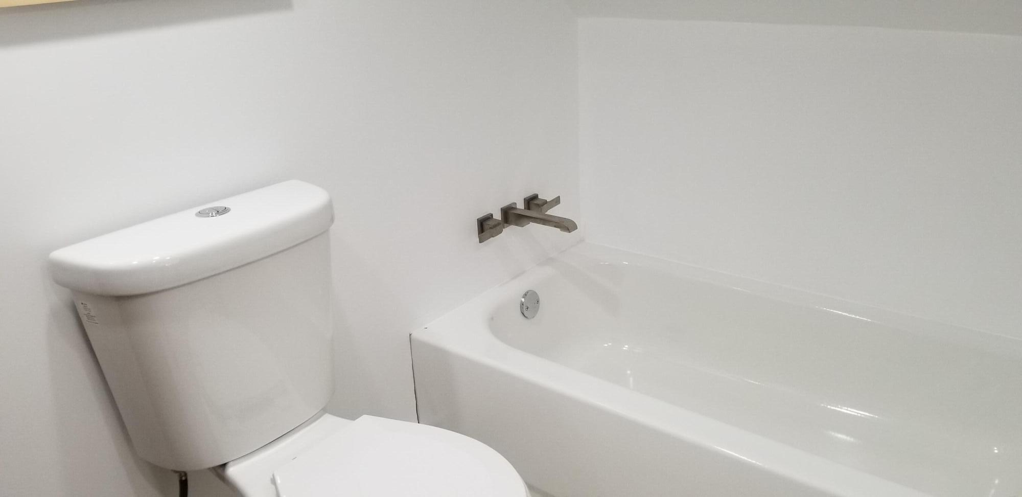 4 Aronovitz Lane Key West, FL 33040 - Photo 33 of 36 a white toilet sitting next to a bath tub