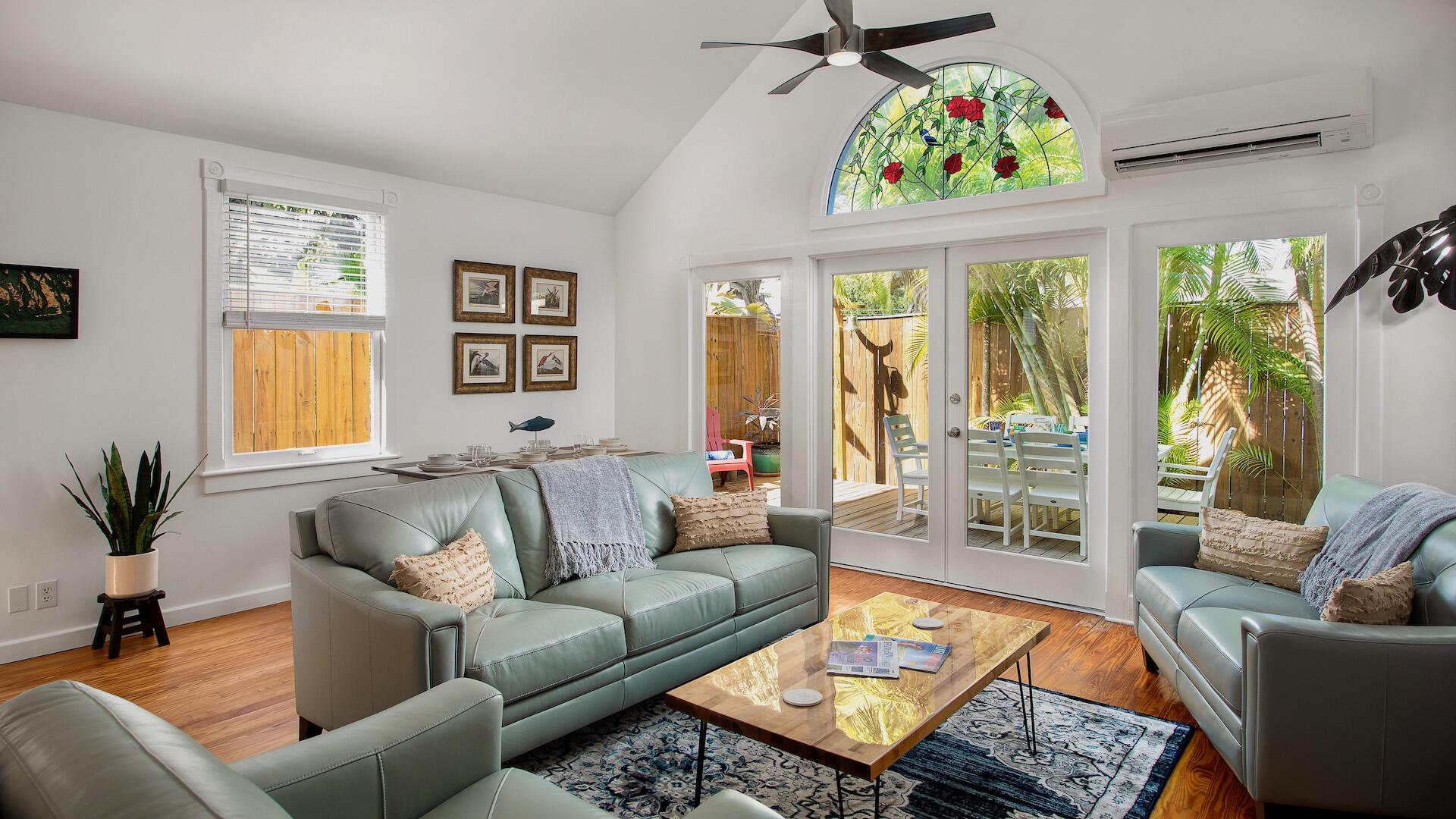 4 Aronovitz Lane Key West, FL 33040 - Photo 4 of 36 a living room with furniture and a flat screen tv