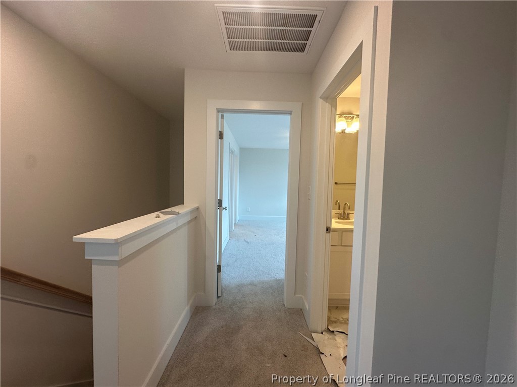 8383 Shannon Road Shannon, NC 28386 - Photo 14 of 17 a view of a hallway with an empty room