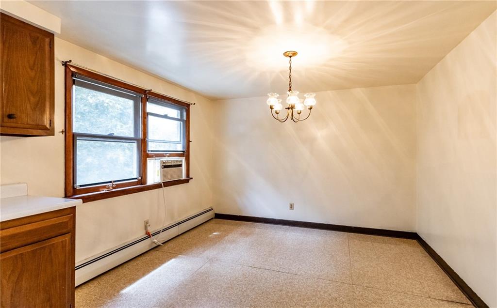 535 Neely Street Baden, PA 15005 - Photo 13 of 42 wooden floor in an empty room with a window