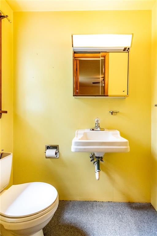 535 Neely Street Baden, PA 15005 - Photo 22 of 42 a bathroom with a sink mirror and toilet