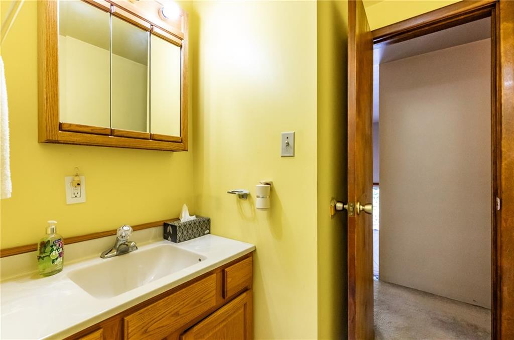 535 Neely Street Baden, PA 15005 - Photo 25 of 42 a bathroom with a sink and a mirror