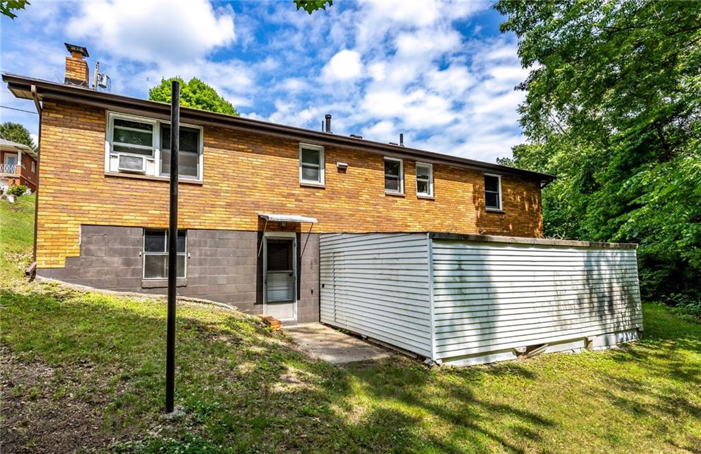 535 Neely Street Baden, PA 15005 - Photo 39 of 42 a front view of a house with garden