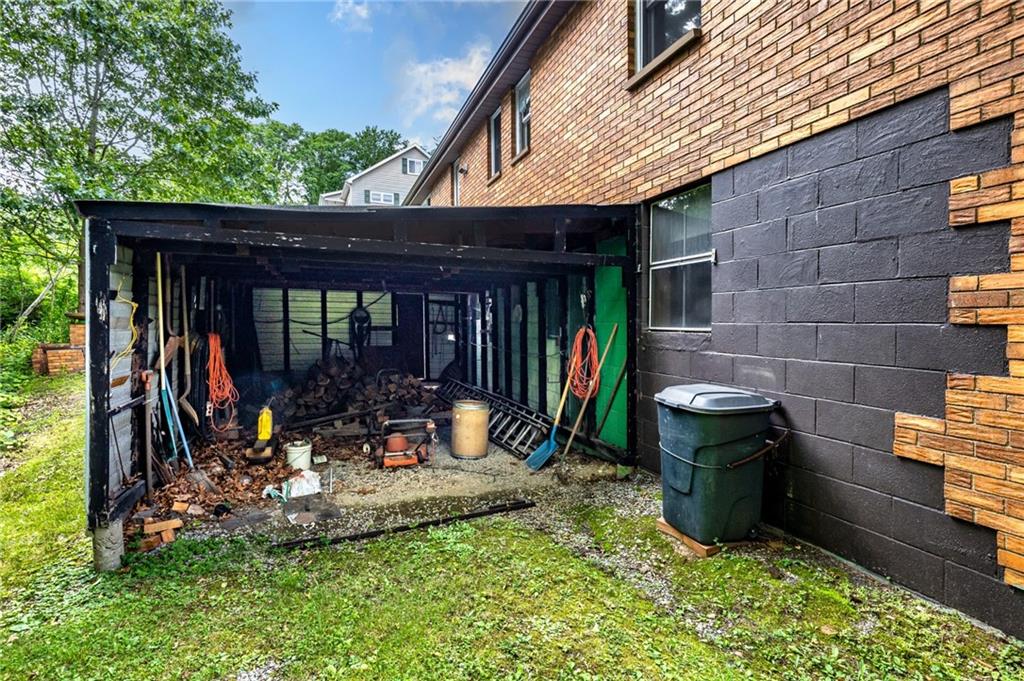 535 Neely Street Baden, PA 15005 - Photo 40 of 42 a view of a patio with table and chairs a barbeque with wooden fence