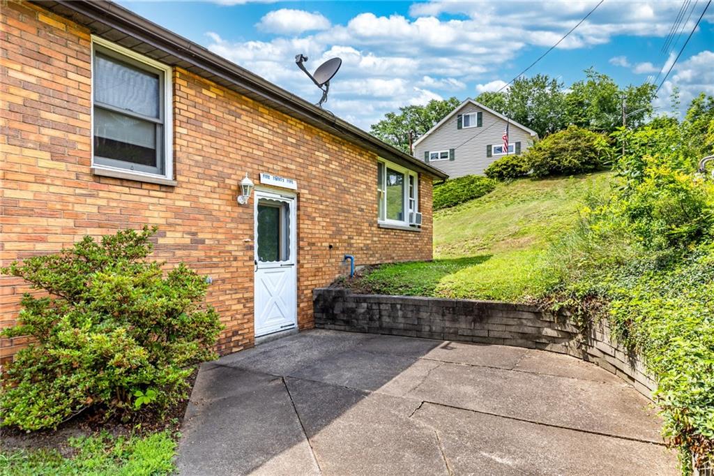 535 Neely Street Baden, PA 15005 - Photo 41 of 42 a front view of a house with a garden