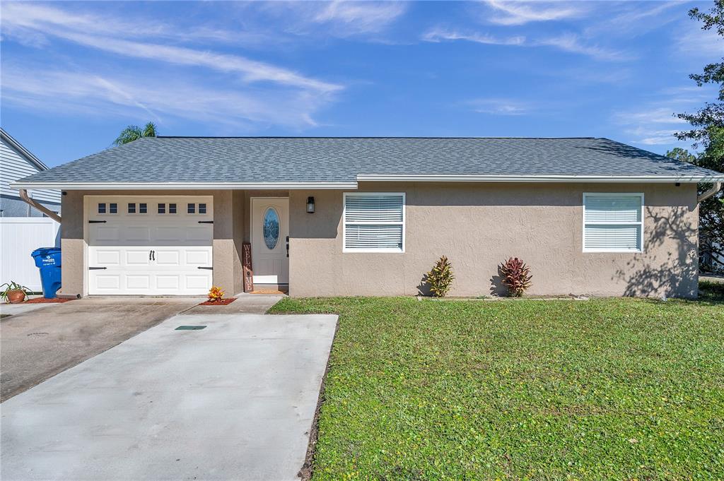 7978 Knox Loop New Port Richey, FL 34655 - Photo 1 of 1 front view of a house with a big yard
