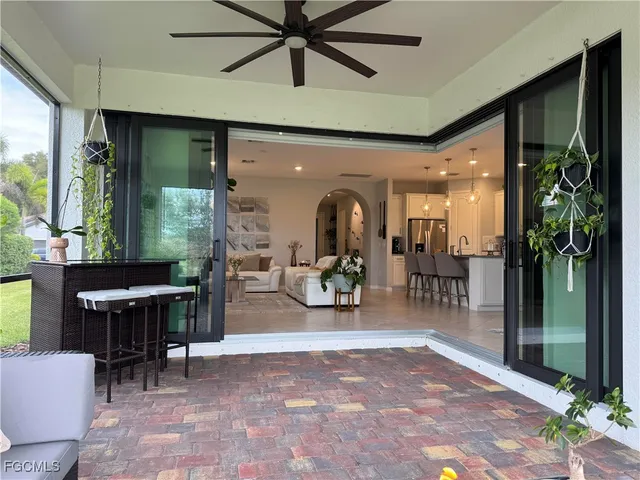 a view of a patio with table and chairs