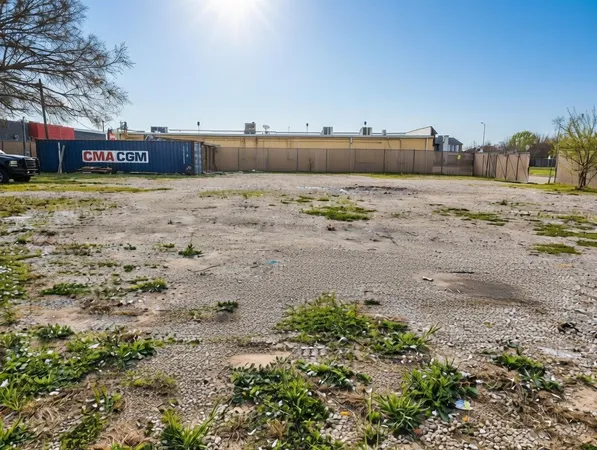 a view of a town with large trees