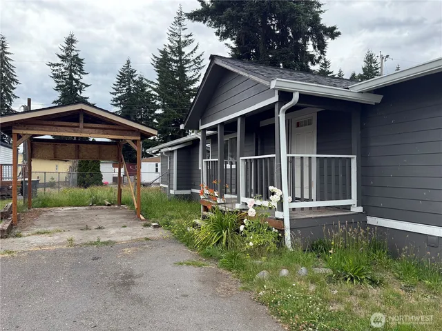 a front view of a house with garden