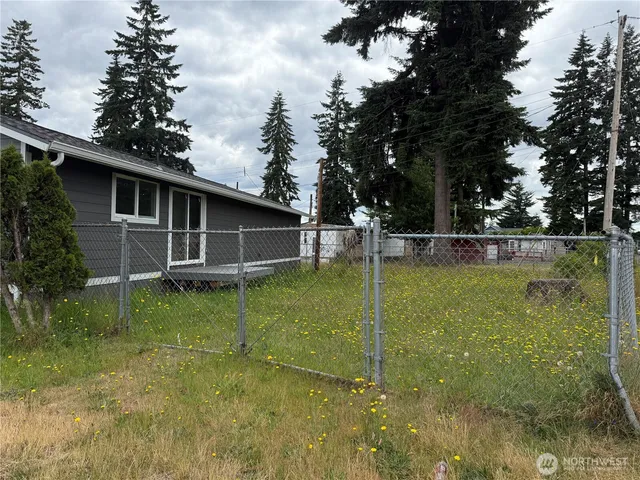 a backyard of a house with lots of green space