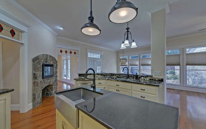 718 Hidden Lake Road Blairsville, GA 30512 - Photo 13 of 34 a kitchen with furniture a counter space a sink and cabinets