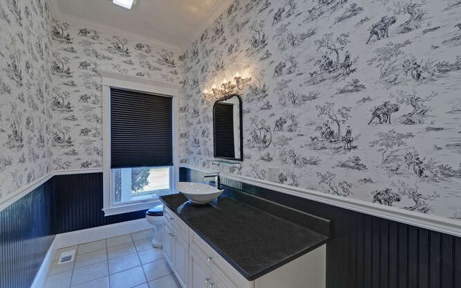 718 Hidden Lake Road Blairsville, GA 30512 - Photo 17 of 34 a bathroom with a sink and a mirror