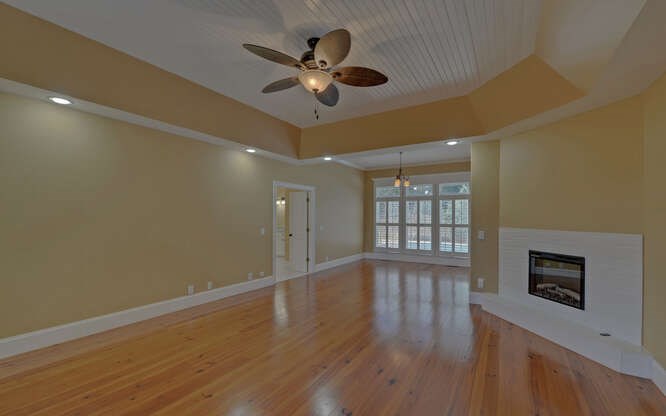 718 Hidden Lake Road Blairsville, GA 30512 - Photo 23 of 34 a view of an empty room with a window and wooden floor