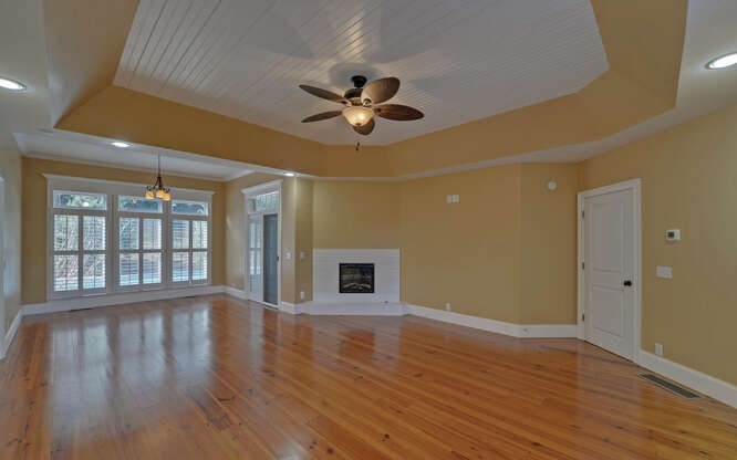 718 Hidden Lake Road Blairsville, GA 30512 - Photo 24 of 34 a view of an empty room with a window and wooden floor