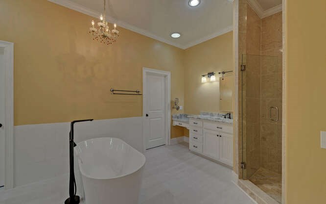 718 Hidden Lake Road Blairsville, GA 30512 - Photo 27 of 34 a bathroom with a tub sink and mirror