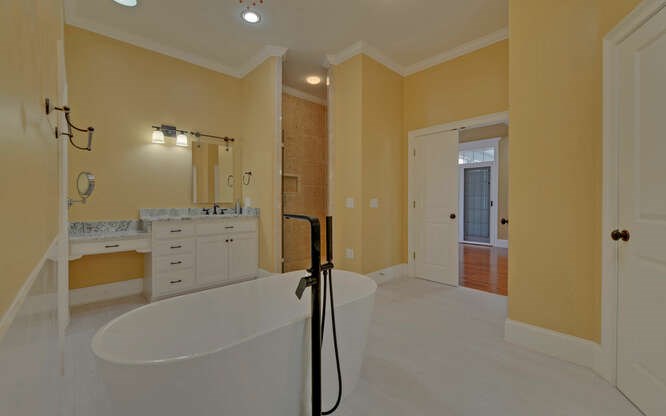 718 Hidden Lake Road Blairsville, GA 30512 - Photo 29 of 34 a bathroom with a tub sink and mirror