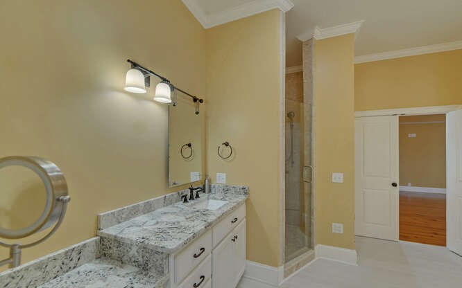 718 Hidden Lake Road Blairsville, GA 30512 - Photo 30 of 34 a bathroom with a granite countertop sink toilet and shower