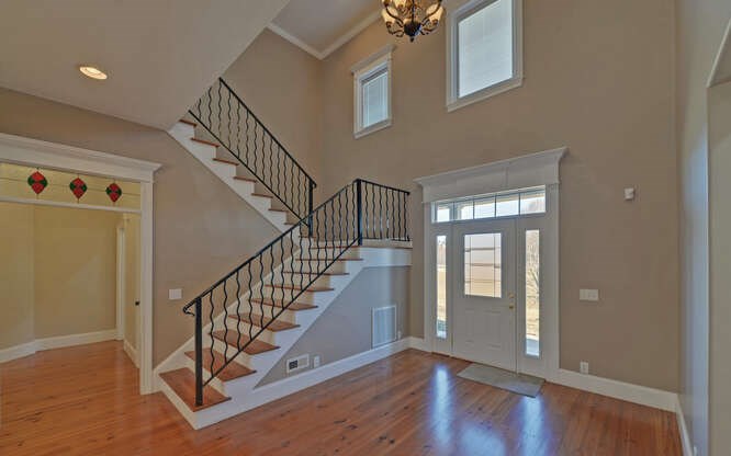 718 Hidden Lake Road Blairsville, GA 30512 - Photo 3 of 34 a view of an entryway with wooden floor and windows