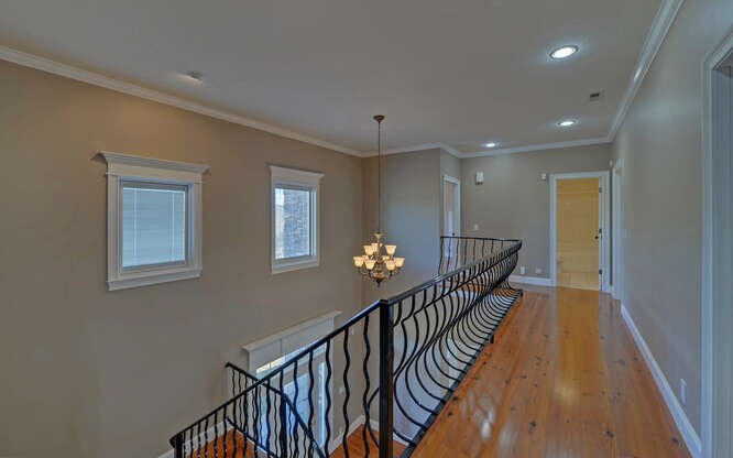 718 Hidden Lake Road Blairsville, GA 30512 - Photo 33 of 34 a view of a hallway with wooden floor and stairs