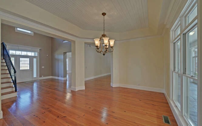 718 Hidden Lake Road Blairsville, GA 30512 - Photo 6 of 34 a view of a room with wooden floor chandelier and windows