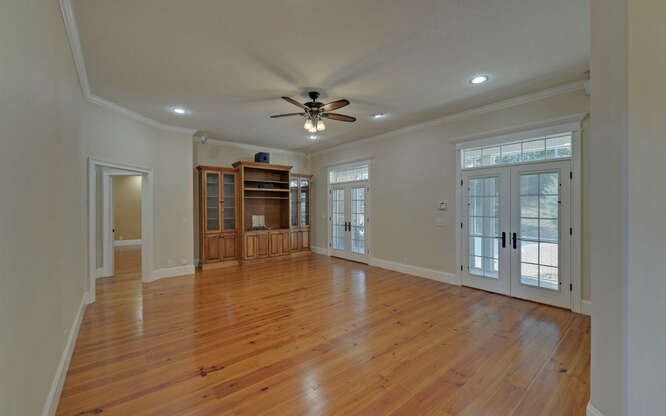 718 Hidden Lake Road Blairsville, GA 30512 - Photo 7 of 34 a view of an empty room with a window and a kitchen