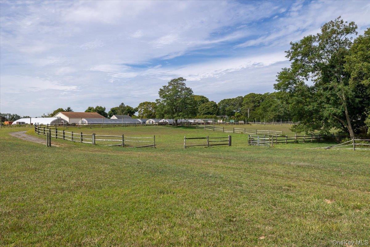 1535 Middle Road Calverton, NY 11933 - Photo 13 of 16 a view of a lake with houses in the back