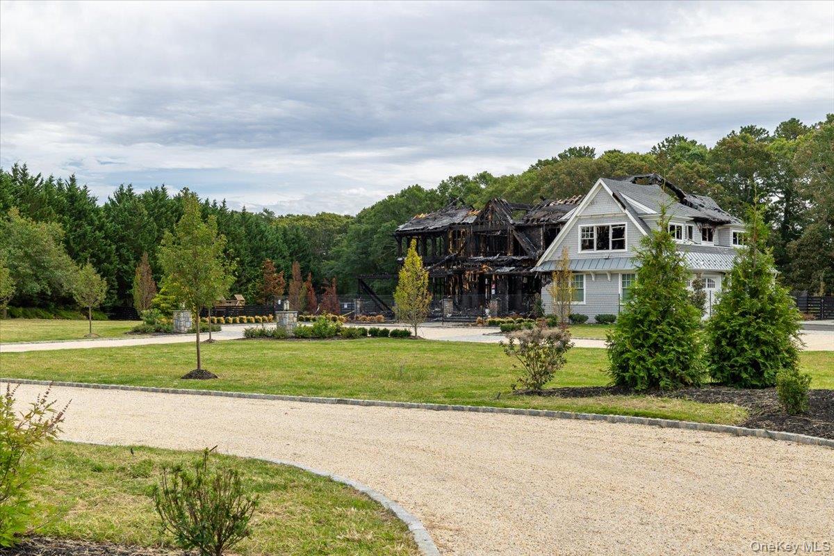 1535 Middle Road Calverton, NY 11933 - Photo 16 of 16 a front view of a house with a yard