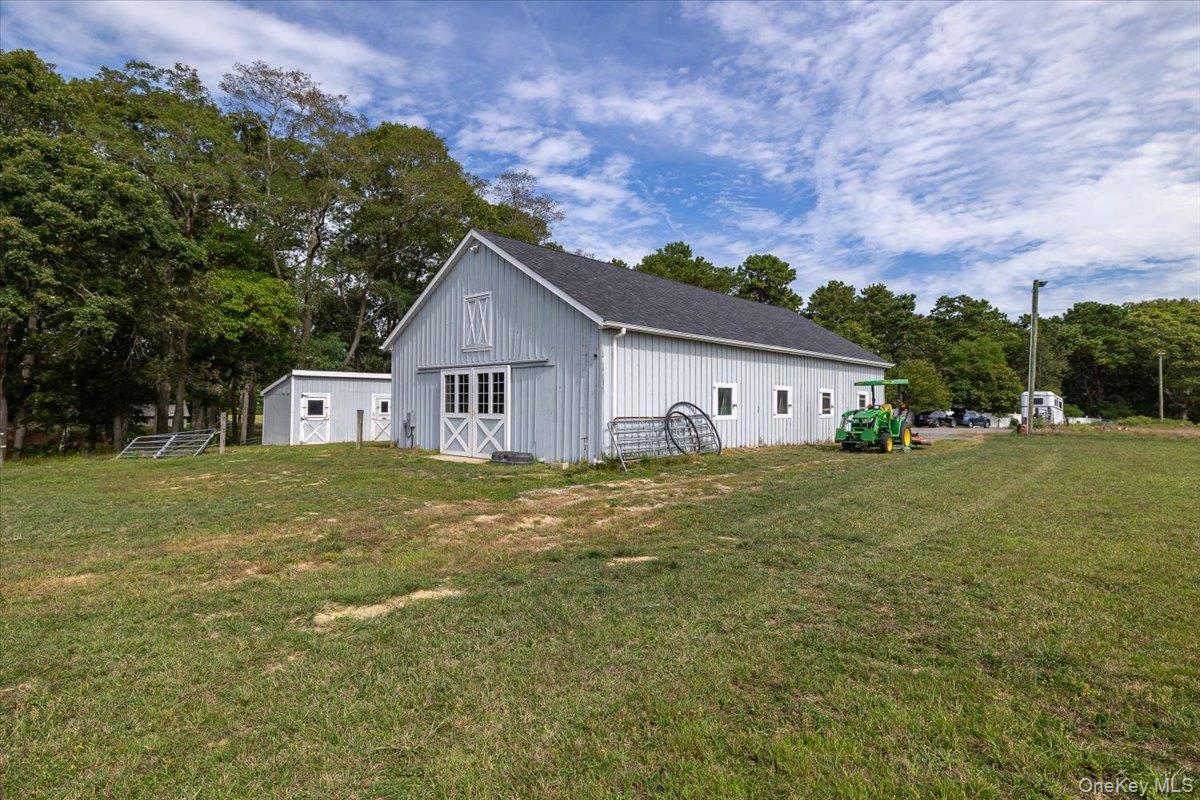1535 Middle Road Calverton, NY 11933 - Photo 4 of 16 a view of a house with a yard