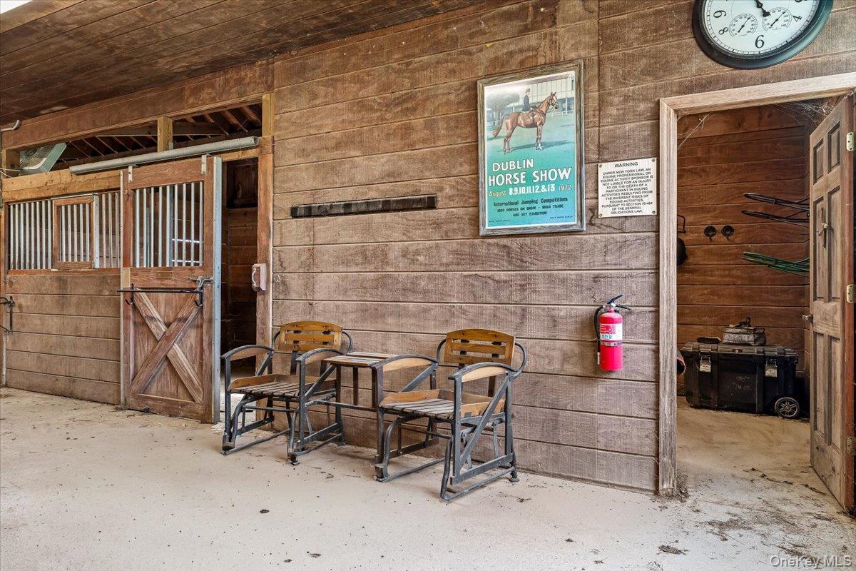 1535 Middle Road Calverton, NY 11933 - Photo 10 of 16 a bench sitting in front of a building