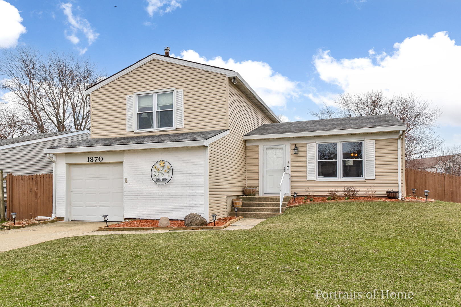 1870 Brighton Circle Aurora, IL 60506 - Photo 1 of 16 a front view of house with yard