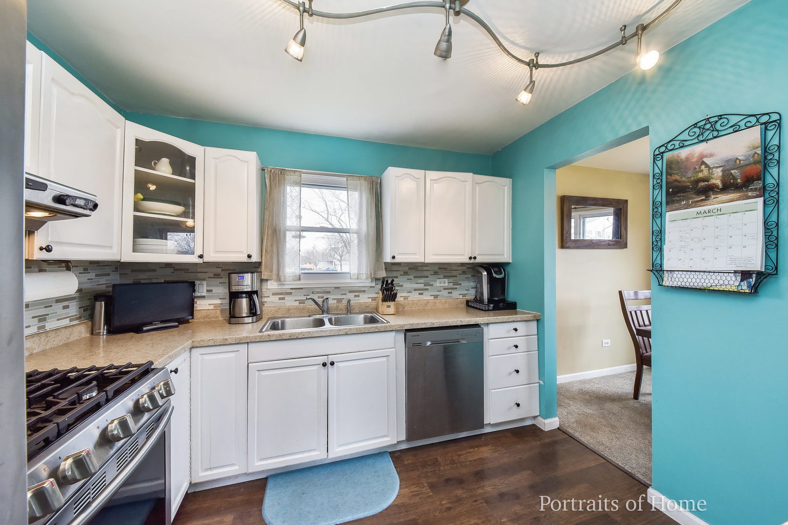 1870 Brighton Circle Aurora, IL 60506 - Photo 5 of 16 a kitchen with a sink stove and cabinets