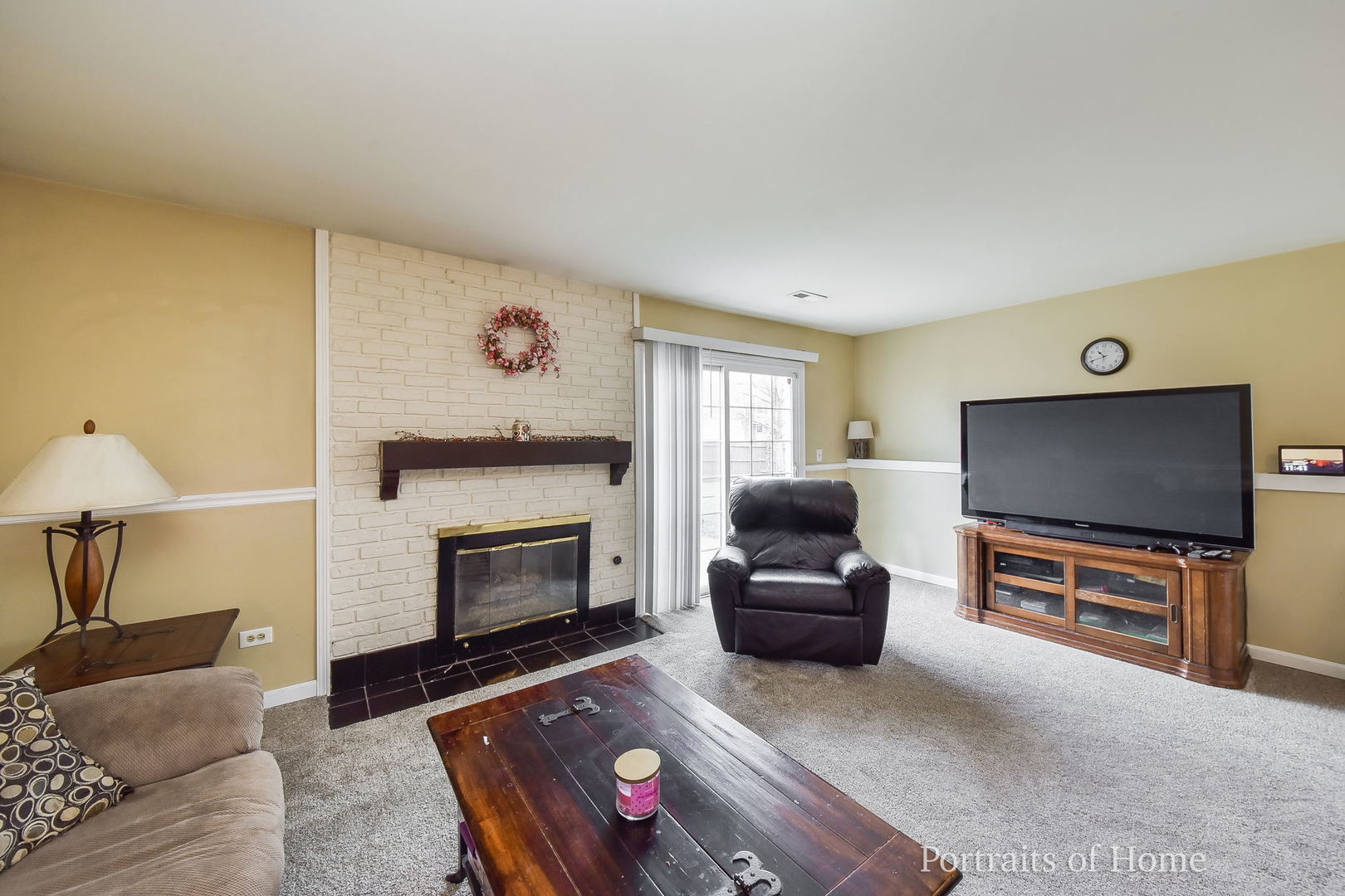 1870 Brighton Circle Aurora, IL 60506 - Photo 8 of 16 a living room with furniture a flat screen tv and a fireplace