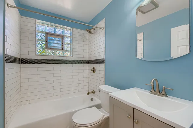 a bathroom with a sink a toilet and a bathtub
