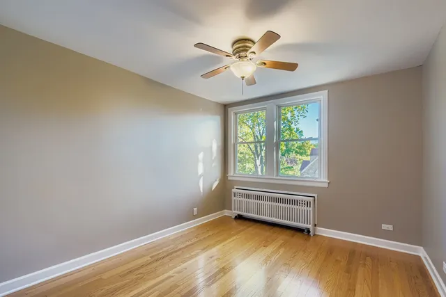a view of room with window and ceiling fan