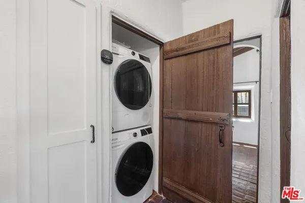 a view of a small space with wooden floor
