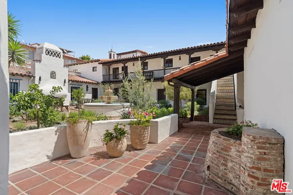 a view of a house with a potted plant