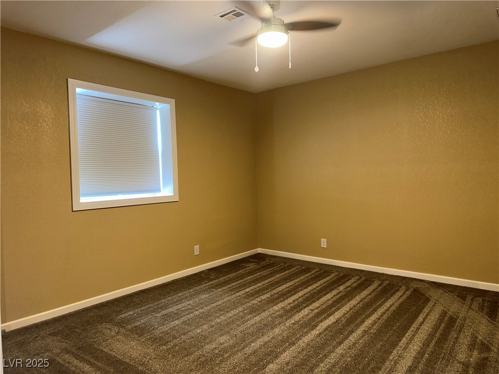 305 Ridge Road Boulder City, NV 89005 - Photo 12 of 30 Empty room with baseboards, visible vents, dark co