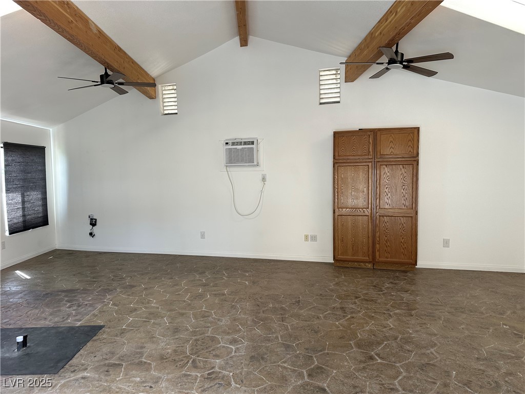 305 Ridge Road Boulder City, NV 89005 - Photo 22 of 30 Spare room featuring high vaulted ceiling, a wall