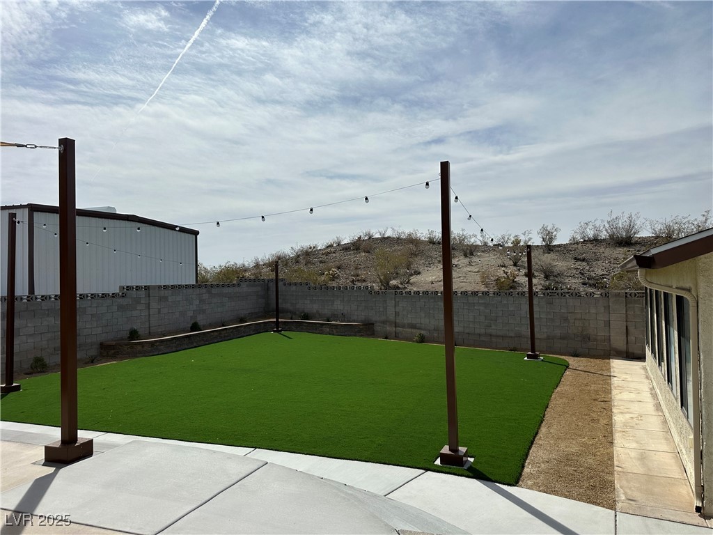 305 Ridge Road Boulder City, NV 89005 - Photo 24 of 30 View of yard featuring a fenced backyard