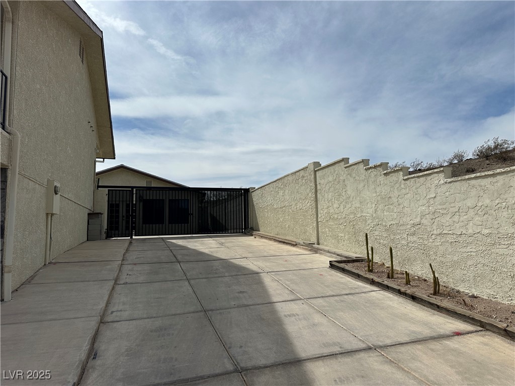 305 Ridge Road Boulder City, NV 89005 - Photo 26 of 30 View of patio / terrace featuring a gate and fence